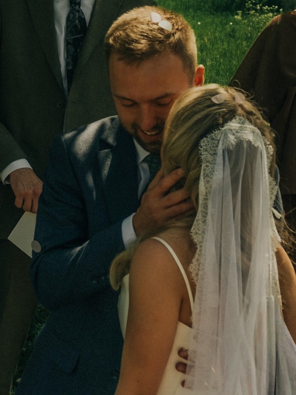 An emotional embrace during a wedding ceremony